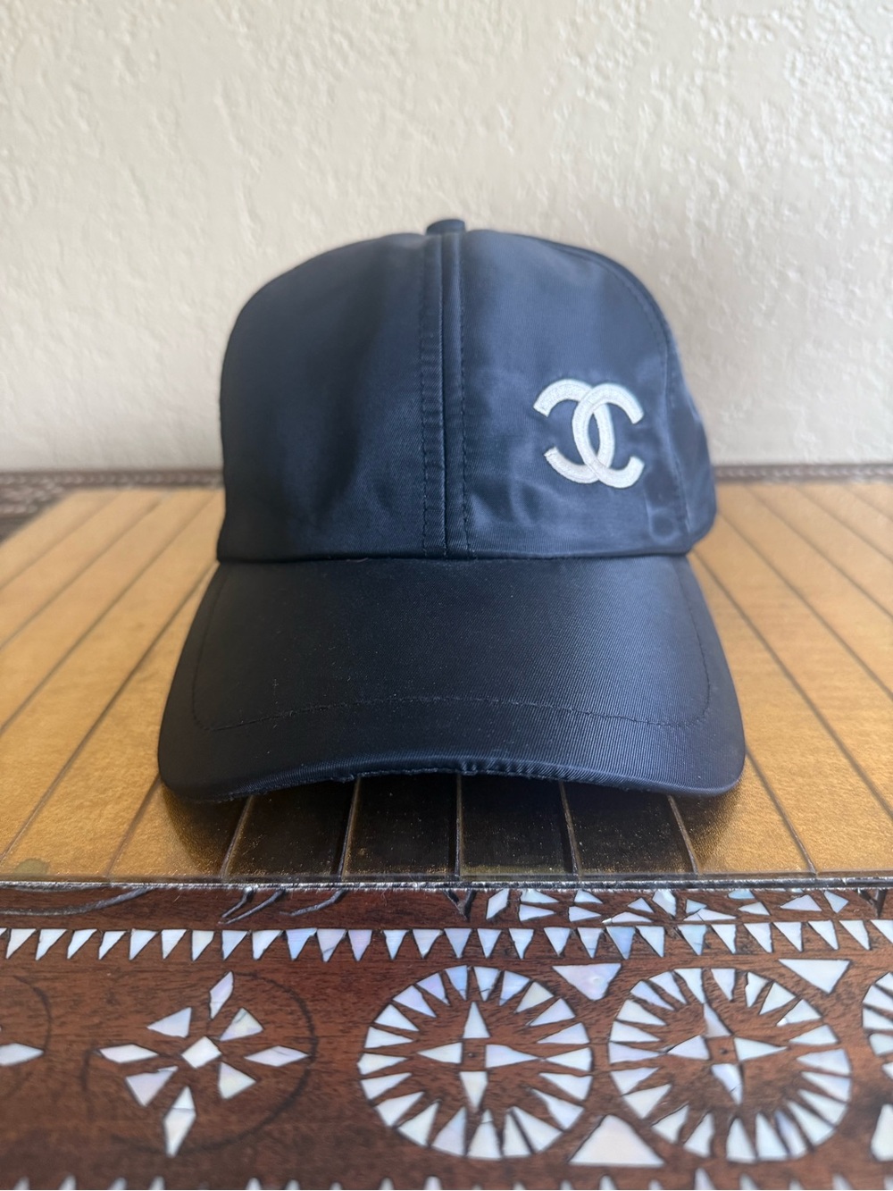 Chanel PGA  tournament  in at Spanish Bay Carmel hat, baseball cap black white